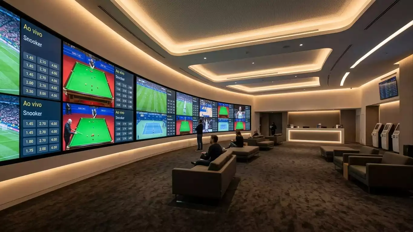 Vista panoramica de sala de apostas desportivas com ecras de snooker e outros desportos